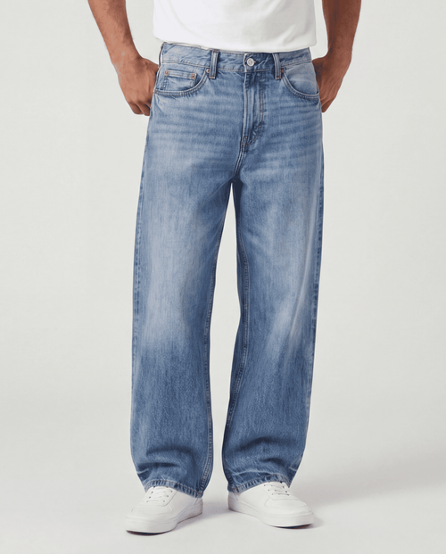 Front detail view of Sama Denim men's light blue baggy fit jeans