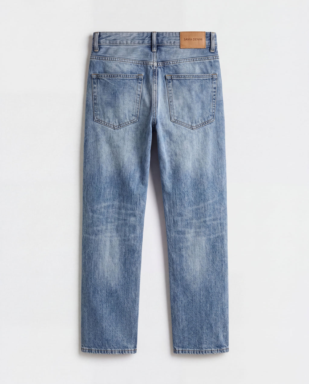 Back flat lay view of Sama Denim men's light wash straight fit jeans with signature leather patch